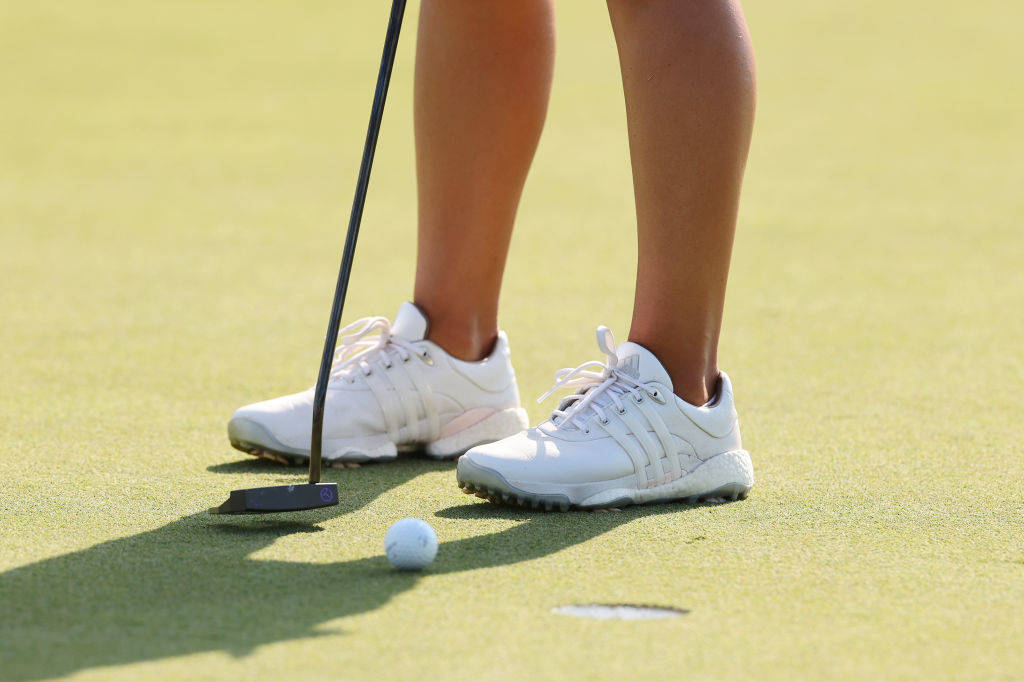 A close up of Danielle Kang's adidas golf shoes